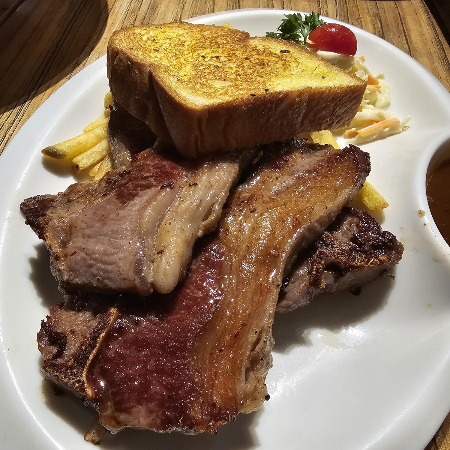 Grilled Lamb Chop with Crispy Fries, Coleslaw and Garlic Bre